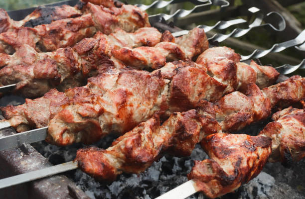 istock Marinated meat, mounted on a skewer, grilled on charcoal. Grilled pork skewers 1250526051