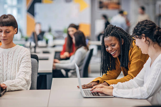 istock Beautiful women working together in big modern office 1250526082