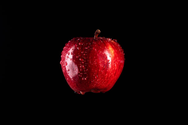 istock Red apple hanging in the air 1250526252