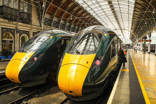London, England - June 2018: High speed trains side by side at a London railway station. The train service is operated by Great Western Railway