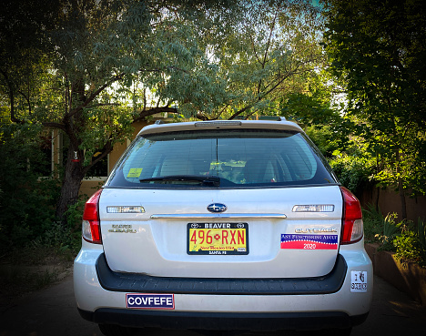 Santa Fe, NM: 2020 political bumper stickers on parked Subaru in downtown Santa Fe.