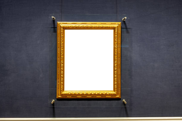 istock Blank antique golden carved picture frame on wall 1250527925