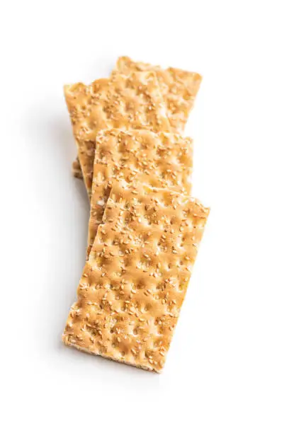 Knackebrot. Wholegrain crispbread with sesame seeds isolated on white background.