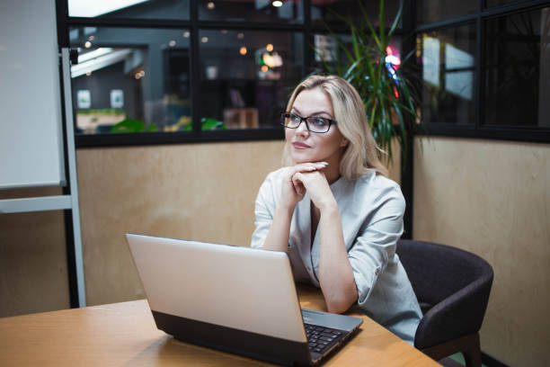 istock Young confident woman working on a laptop in the office. 1250531132
