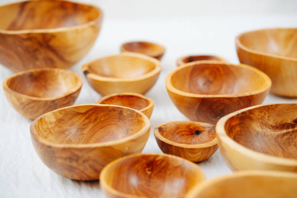 istock Variety of differently sized handmade wooden bowls on a white surface 1250533577