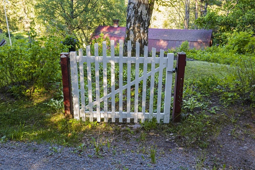 Close up view of freestanding old  wooden  gate without fence. Funny backgrounds.