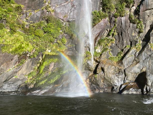 istock Rainbow at Milford sound waterfall 1250540998