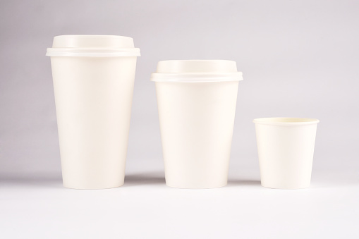 Front view Three sizes paper coffee cups isolated on white background