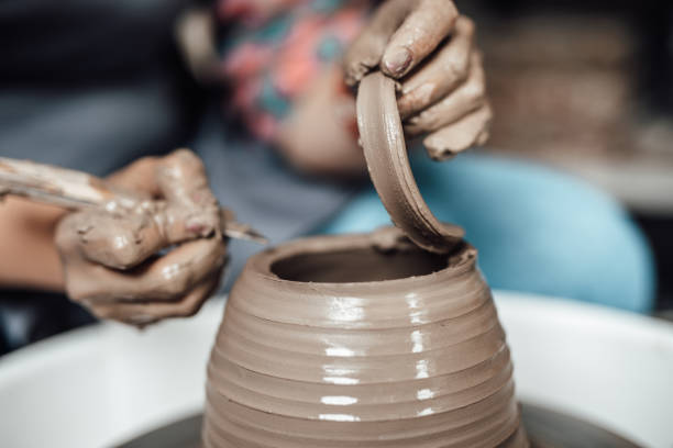 istock Female potter hands close up 1250547470