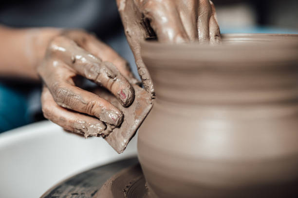 istock Female potter hands close up 1250548013