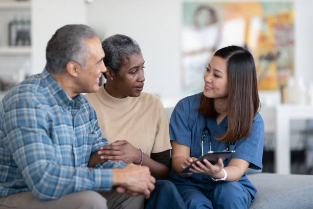 istock Nurse visits elderly couple in their home 1250551024