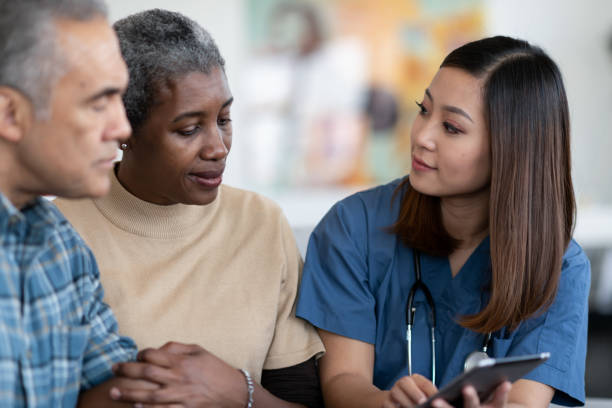 istock Nurse visits elderly couple in their home 1250551029