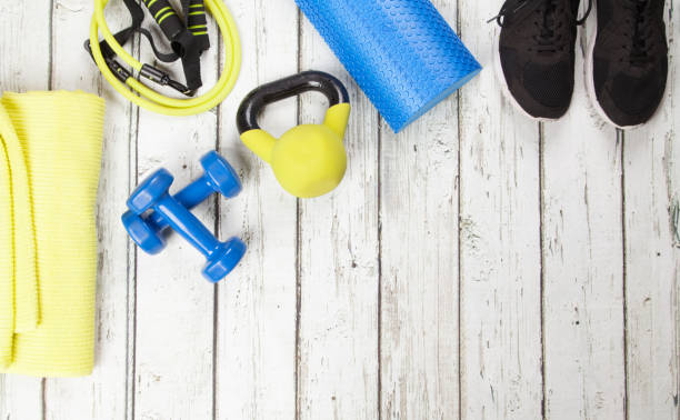 istock Fitness & exercise equipment knolling on floorboards 1250558171