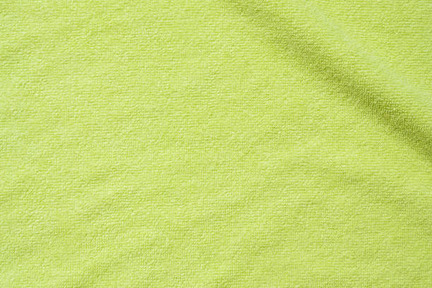 istock Green towel fabric texture surface close up background 1250558246