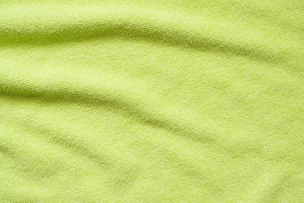 istock Green towel fabric texture surface close up background 1250558251
