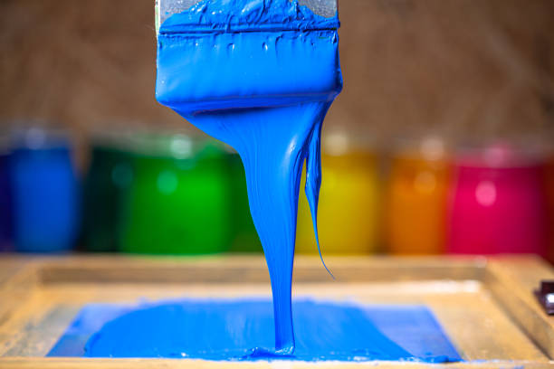 istock blue color dripping from hand screen printing 1250559365