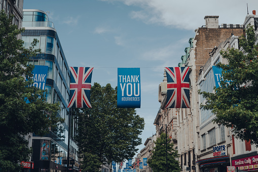 London, UK - June 13, 2020: Thank You banners and Union Jack flags on New Oxford Street, a famous and busy shopping street in Central London, UK.