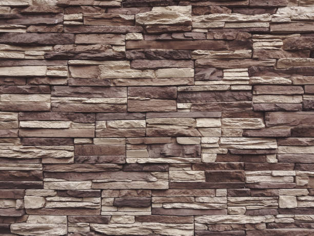 istock dark beige and brown slate stone wall texture 1250560723