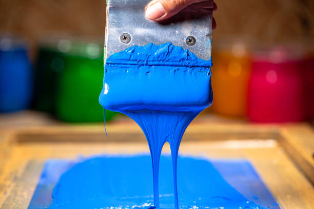 istock blue color dripping from hand screen printing 1250561319