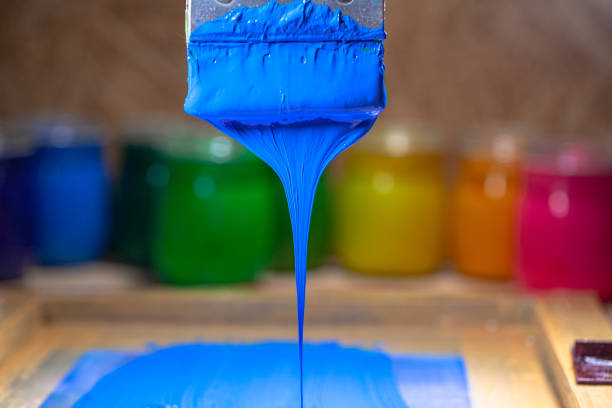 istock blue color dripping from hand screen printing 1250561323