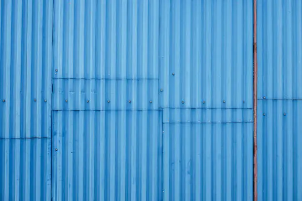 Texture background of blue corrugated metal fence
