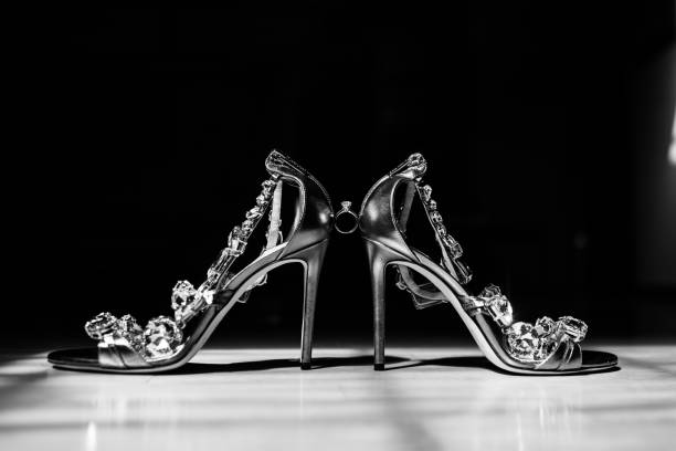 istock Bride's shoes Between them is a wedding ring. 1250566530