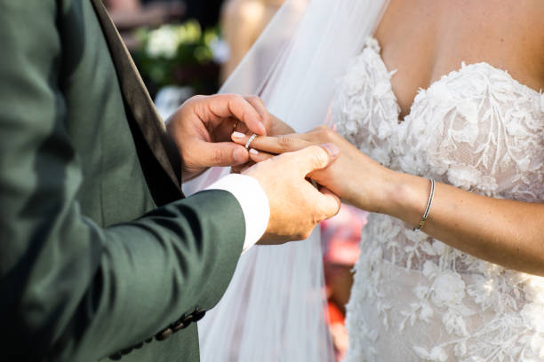 istock Couple. You can see the hands touching each other. 1250566564