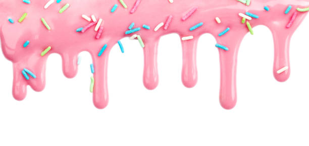розовый капает глазурь глазурь с красочными брызгами изолированы на белом фоне - white icing стоковые фото и изображения