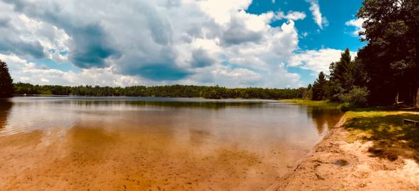 Panoramic view of empty beach on a beautiful summer day in rural Wisconsin. stock photo