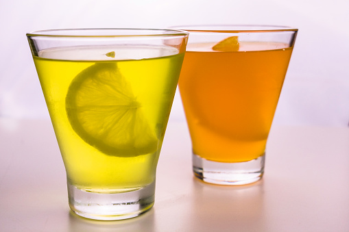 Lemon and orange jelly in glasses on  a white background.
