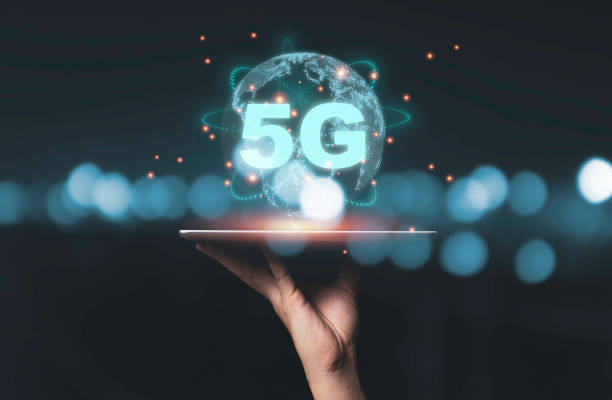 istock Hand holding tablet with 5G  and virtual global connection line. communication technology transformation concept. 1250581349