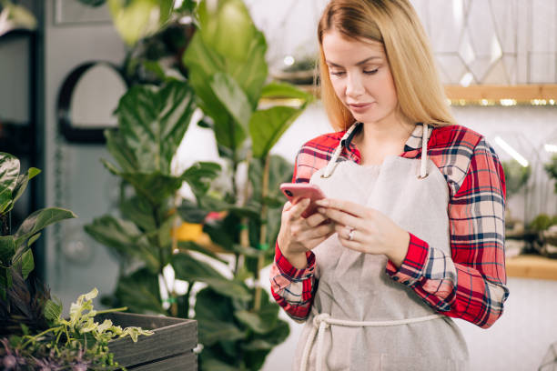 istock happy caucasian lady florist at work 1250581741