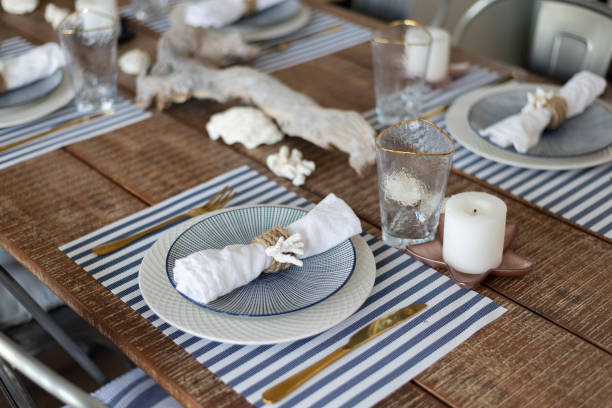 istock A silver-out table. plates and appliances in a wooden style. tree branch. table, chairs 1250582871