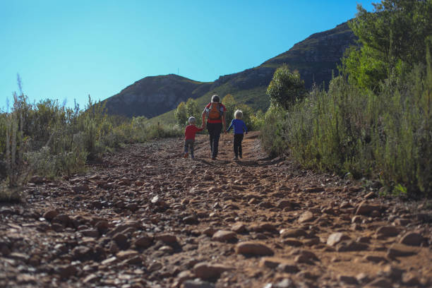 istock A single mom walking with her boys up a steep rocky road 1250583830