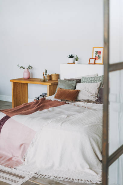 istock Scandinavian modern cozy bright interior in bedroom 1250586479