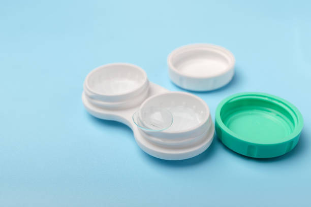istock Contact lens close-up on a container on a blue background with copy space 1250590548