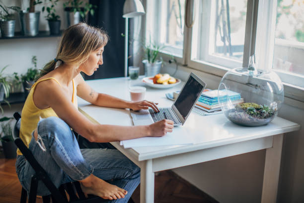 istock Beautiful woman studying for exam at home 1250593455