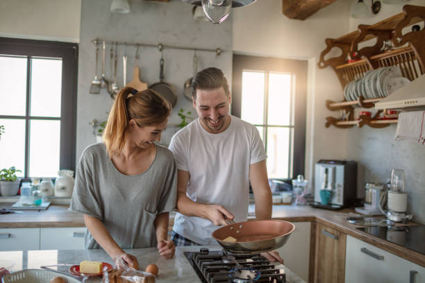 istock Young couple cooking together 1250593531