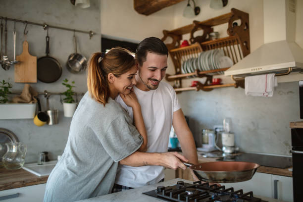 istock Young couple cooking together 1250593578