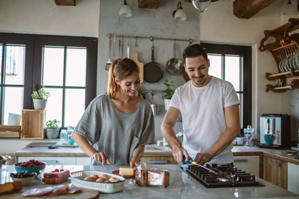 istock Young couple cooking together 1250593651