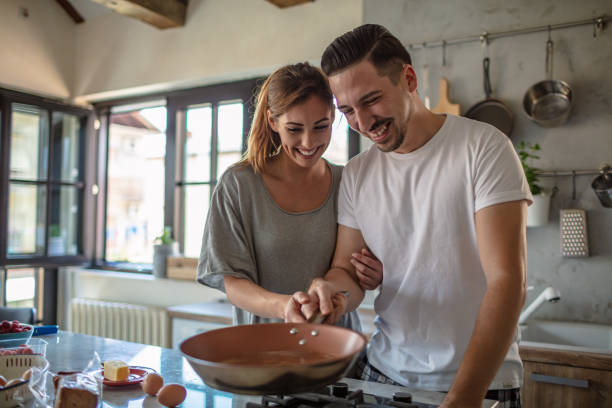 istock Young couple cooking together 1250593770