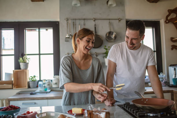 istock Young couple cooking together 1250593913