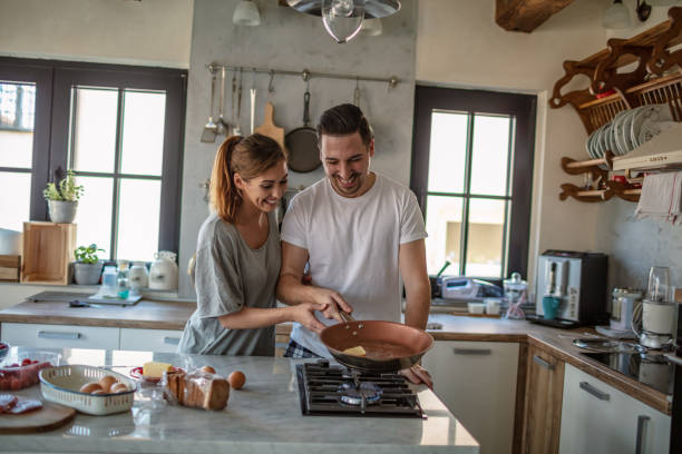 istock Young couple cooking together 1250593975