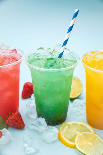 istock colored lemonades in plastic cups with ice, fruits and berries 1250600101