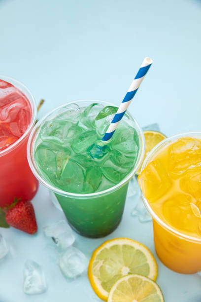 istock colored lemonades in plastic cups with ice, fruits and berries 1250600151