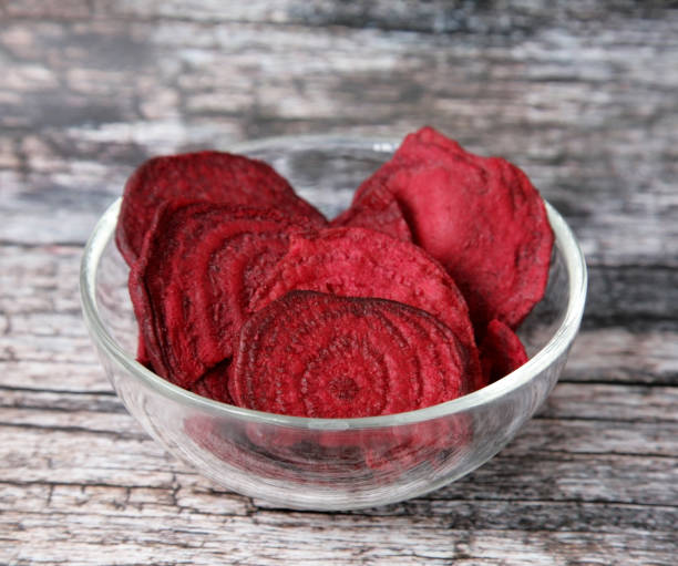 istock Dried beets in a glass cup on a wooden background 1250601135