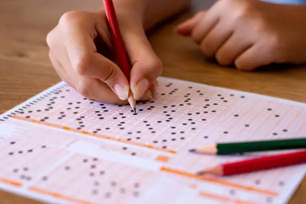 Optical exam form with pen and eraser.