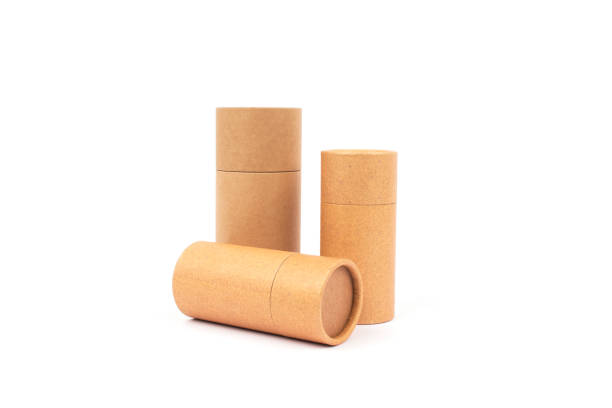 istock Brown paper tubes isolated on white. Recyclable and reusable ecological paper packaging concept. Mockup 1250603544