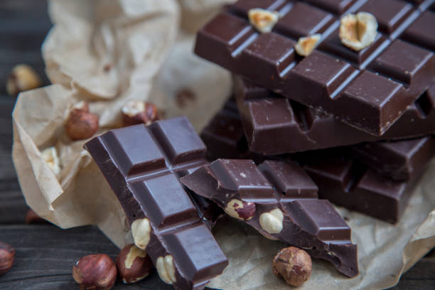 istock A piece of chocolate with hazelnuts and nuts 1250609006
