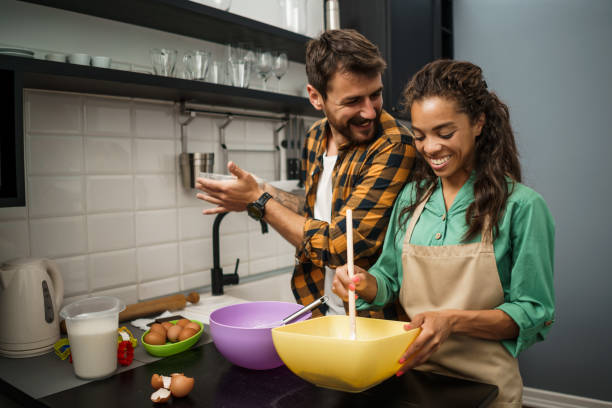 istock Young couple making cookies 1250612852
